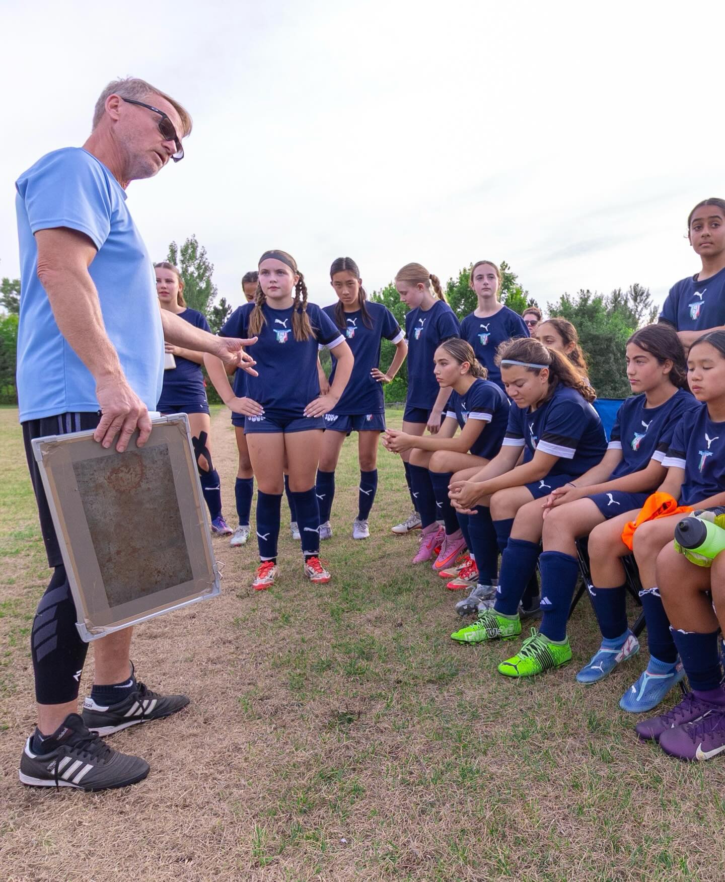 Team talk on the sideline — St. Anthony's Soccer Club, Apr 2026